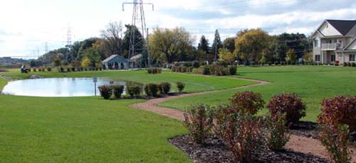Condominium Landscaping, Pathways, and Pond